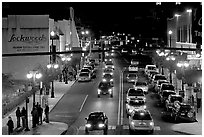 Central avenue with lots of cars and pedestrican on street. Hot Springs, Arkansas, USA (black and white)