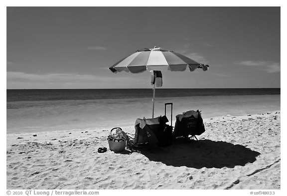Beach umbrella and turquoise water, Bahia Honda State Park. The Keys, Florida, USA (black and white)