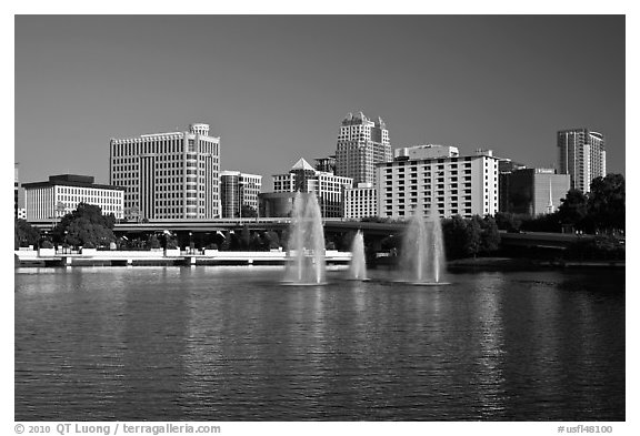 Fountains and morning skyline from Lake Lucerne. Orlando, Florida, USA (black and white)