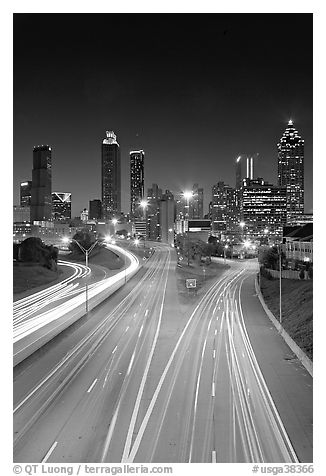 Highway and Atlanta skyline at night. Atlanta, Georgia, USA