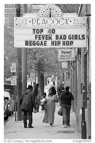 African American people on sidewalk in front of Peackok music store. Atlanta, Georgia, USA (black and white)