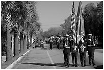 Marines carrying flag during parade. Beaufort, South Carolina, USA (black and white)