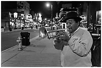 Jazz Street Musician on Beale Street by night. Memphis, Tennessee, USA (black and white)