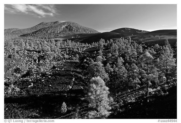 Volcanic hills covered with black lava and cinder. Sunset Crater Volcano National Monument, Arizona, USA (black and white)