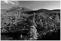 Volcanic hills covered with black lava and cinder. Sunset Crater Volcano National Monument, Arizona, USA ( black and white)