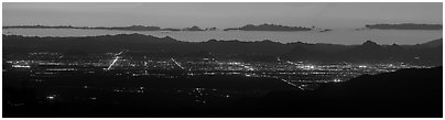 Tucson lights at sunset from Rincon Mountains. Tucson, Arizona, USA (Panoramic black and white)