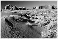 Sand dune and mesas, late afternoon. Monument Valley Tribal Park, Navajo Nation, Arizona and Utah, USA (black and white)