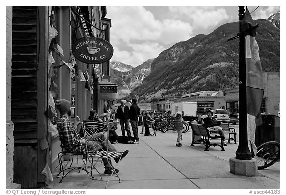 Men sitting on main street sidewalk. Telluride, Colorado, USA (black and white)