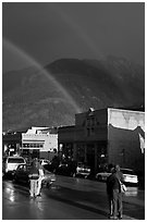 People watching double rainbow on main street. Telluride, Colorado, USA (black and white)