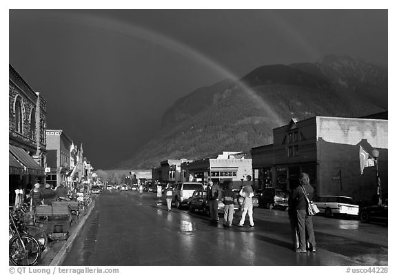 Double rainbow and dark sky over main street. Telluride, Colorado, USA (black and white)
