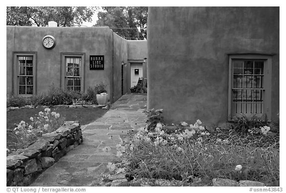 Front yard and pueblo style houses. Taos, New Mexico, USA (black and white)