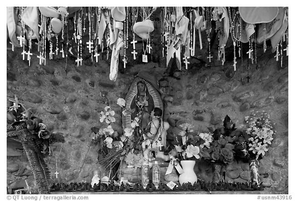 Niche with popular worship objects, Sanctuario de Chimayo. New Mexico, USA (black and white)