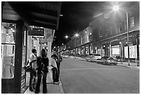 People in historic district by night. Santa Fe, New Mexico, USA ( black and white)