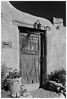 Wooden door and adobe wall. Santa Fe, New Mexico, USA ( black and white)