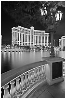 Lamp, reflection lake, and Bellagio hotel at night. Las Vegas, Nevada, USA ( black and white)