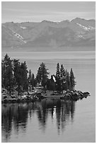 Cabin on lakeshore and snowy mountains, Lake Tahoe, Nevada. USA ( black and white)