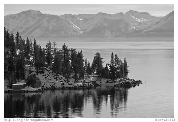 Lakeshore with houses and snow-covered mountains, Lake Tahoe, Nevada. USA