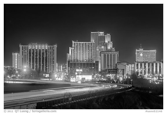 Illuminated casinos and freeway at night. Reno, Nevada, USA