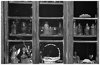 Old bottles in a store window, Austin. Nevada, USA (black and white)