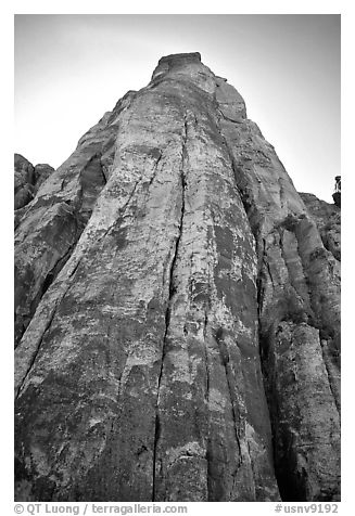 Tall sandstone wall with rock climbers. Red Rock Canyon, Nevada, USA (black and white)