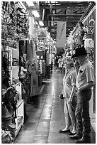 Man with cowboy hat and woman look at crafts, Market Square. San Antonio, Texas, USA ( black and white)