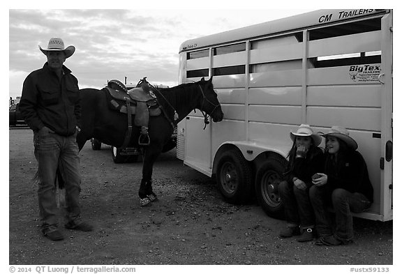Group talking next to horse and trailer. Fort Worth, Texas, USA (black and white)