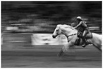 Woman on galloping horse, Stokyards Championship Rodeo. Fort Worth, Texas, USA ( black and white)