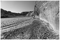 Cliffs and cracked mud. Paria Canyon Vermilion Cliffs Wilderness, Arizona, USA ( black and white)