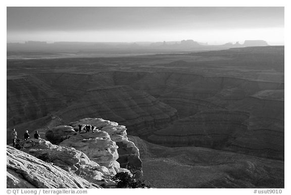 Watching the sunset over the San Juan River, Monument Valley in the background. Utah, USA (black and white)