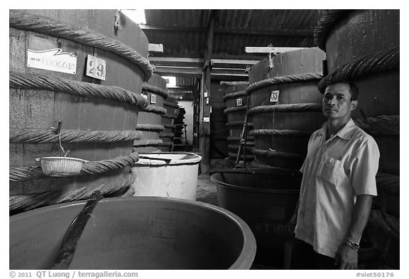 Worker in fish sauch factory, Duong Dong. Phu Quoc Island, Vietnam (black and white)