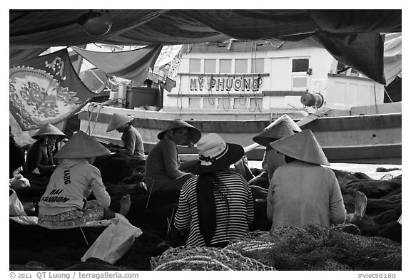Women repairing fish nets, Duong Dong. Phu Quoc Island, Vietnam (black and white)