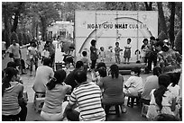 Children singing, Cong Vien Van Hoa Park. Ho Chi Minh City, Vietnam (black and white)