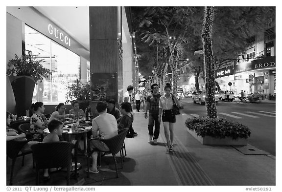 Street with luxury stores at night. Ho Chi Minh City, Vietnam (black and white)