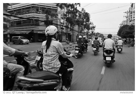 Motorcycle traffic seen from the street. Ho Chi Minh City, Vietnam (black and white)