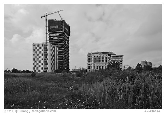 High rise towers in construction on former swampland, Phu My Hung, district 7. Ho Chi Minh City, Vietnam