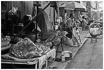 Vendors sleeping on the street at dawn. Ho Chi Minh City, Vietnam (black and white)