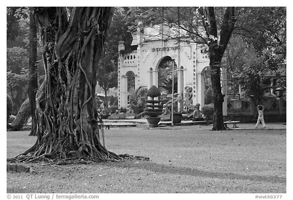 Tree, lawn, and gate, Cong Vien Van Hoa Park. Ho Chi Minh City, Vietnam
