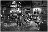 Street flooded by mooson rains at night. Ho Chi Minh City, Vietnam (black and white)