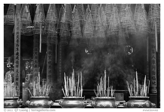 Urns, incense coils, and incense smoke, Thien Hau Pagoda. Cholon, District 5, Ho Chi Minh City, Vietnam