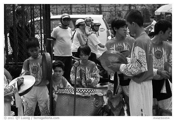 Dragon dance band made of children, Thien Hau Pagoda. Cholon, District 5, Ho Chi Minh City, Vietnam (black and white)