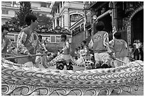 Dancers animating dragon, Thien Hau Pagoda, district 5. Cholon, District 5, Ho Chi Minh City, Vietnam (black and white)