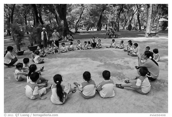 Uniformed schoolchildren, Cong Vien Van Hoa Park. Ho Chi Minh City, Vietnam (black and white)