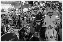 Street filled with motorcycles at rush hour. Ho Chi Minh City, Vietnam (black and white)