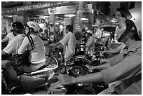 Motorcyle riders in traffic gridlock. Ho Chi Minh City, Vietnam (black and white)