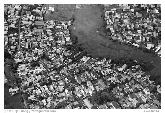 Aerial view of houses and fields on the outskirts of the city. Ho Chi Minh City, Vietnam