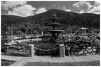 Fountain and forested peak. Ta Cu Mountain, Vietnam (black and white)