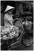 Woman selling bananas from bicycle. Ho Chi Minh City, Vietnam ( black and white)