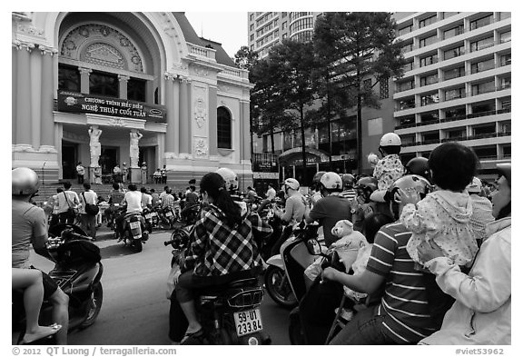 Families gather on moterbikes to watch musical performance. Ho Chi Minh City, Vietnam (black and white)