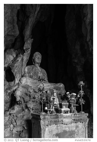 Altar and Buddha statue in grotto. Da Nang, Vietnam (black and white)