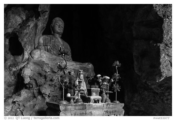 Altar and Buddha statue in cave. Da Nang, Vietnam (black and white)